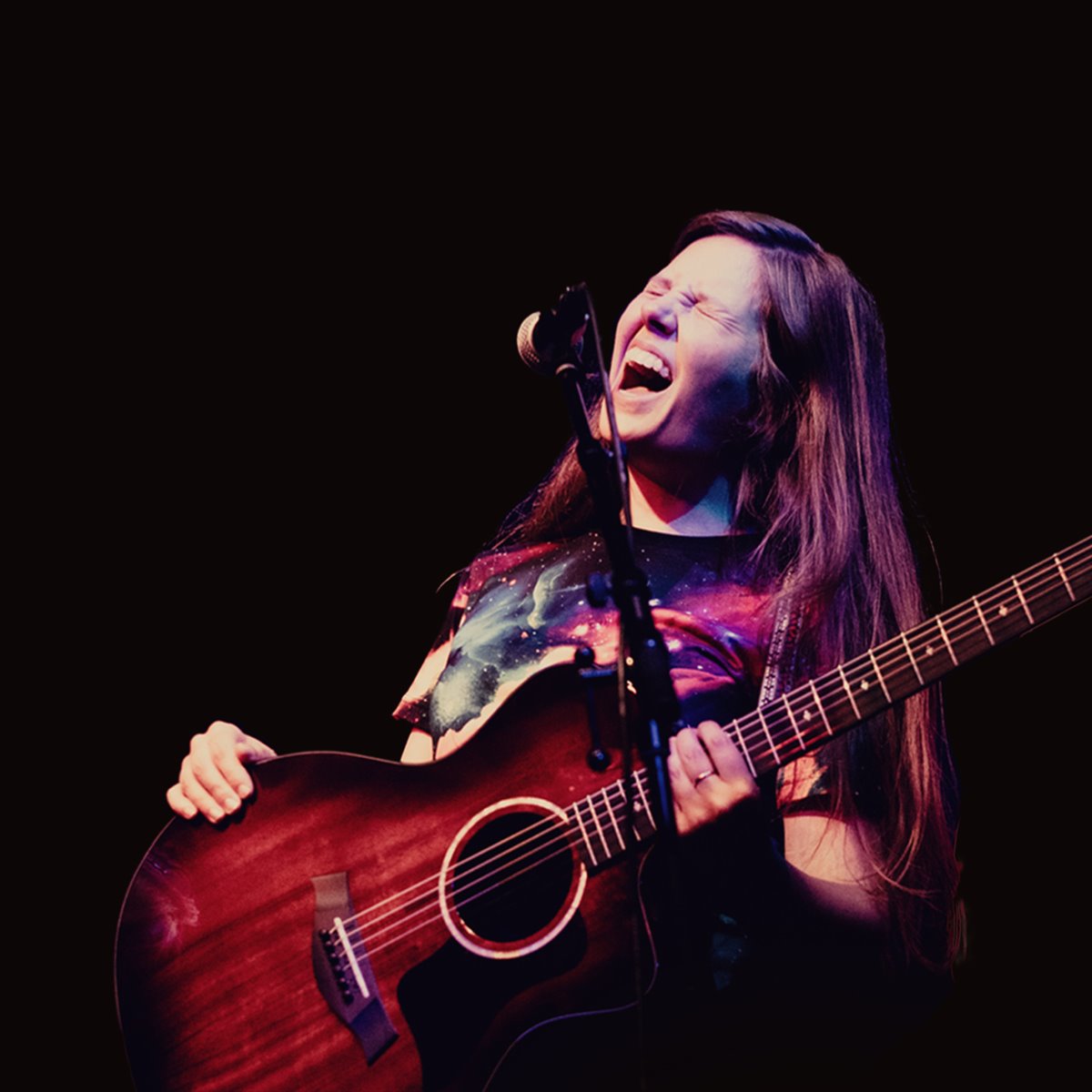 article thumb - Liz Jones playing a guitar and singing