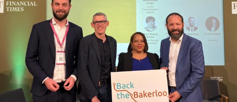 Leader of Southwark Council Cllr Kieron Williams, Mayor of Lewisham Brenda Dacres, as well as Patrick Doig the Group Finance Director from TfL, Harriet Shone Director of London Communications Agency and Richard Palmer the Development Director from Delancey hold "Back the Bakerloo" placard.