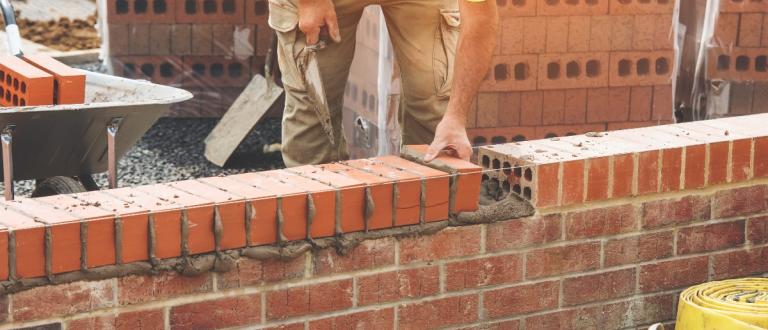 Bricks being laid as part of council home construction