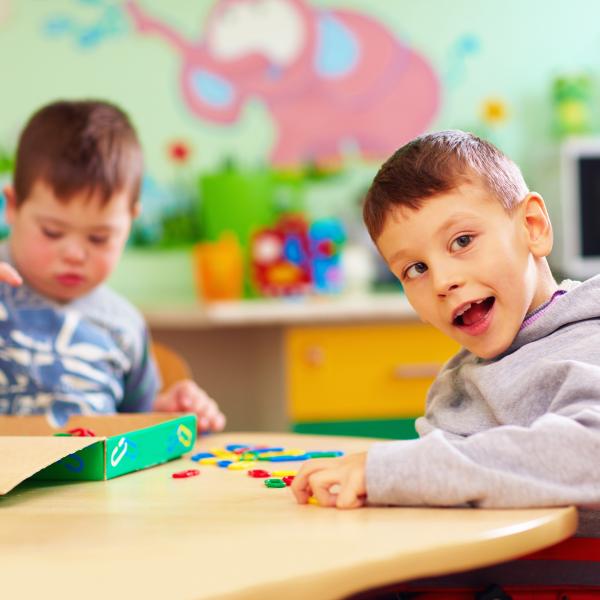 Two children at a play table