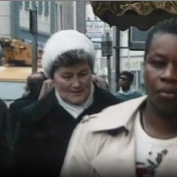 Street scene with people walking towards the camera