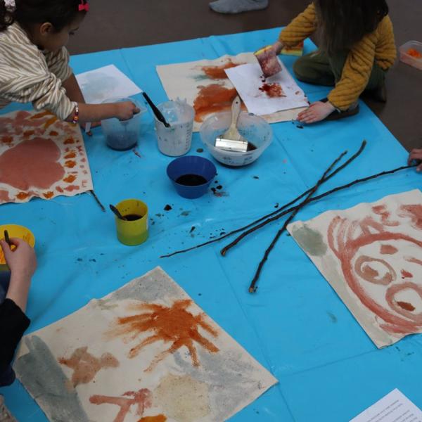 Children making craft on blue table